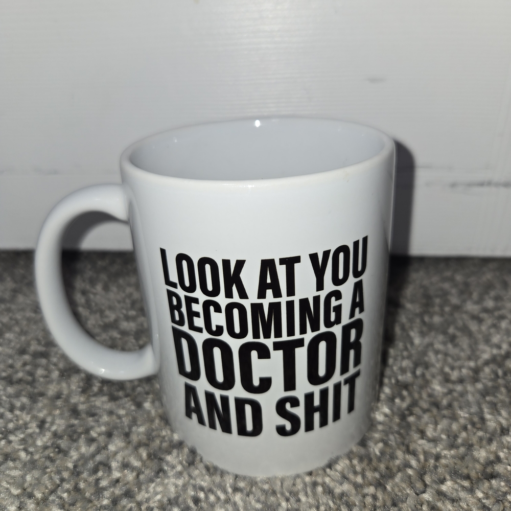 Look At You Becoming A Doctor And Sh!t White Ceramic Mug with Motivational Text